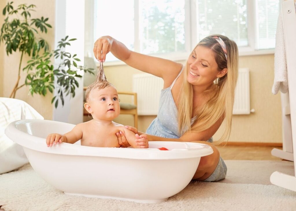 happy mom. and baby in bath